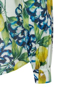 White shirt sleeve with buttoned cuff featuring blue floral and yellow lemon print with green leaves.
