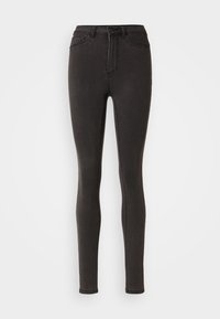 Skinny jeans in black denim, featuring a high waist, belt loops, and side pockets. Smooth texture with subtle stitching details.