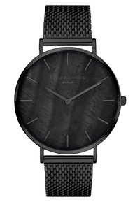 Zwarte horloge met een mesh band en een ronde wijzerplaat. De wijzerplaat heeft een gestructureerd zwarte oppervlak en minimale uuraanduidingen. Merkennaam zichtbaar.