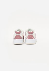 Sneakers with a pink suede back panel, white mesh sides, and a white rubber sole. Features angular accents on the heel and a cushioned interior.