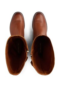 Brune lærstøvletter til knæhøjde med rund tå og diskrete syninger. Indvendigt har de en glat foring og en lynlås i siden.