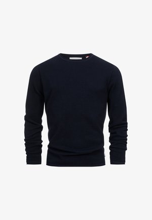 Navyblauwe blouse met lange mouwen en een gestructureerd breiwerk ontwerp en ronde halslijn. Met nauwsluitende mouwen en een subtiele merklabel aan de zoom.