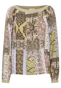 Blouse à manches longues avec motifs patchwork dans des tons terre, des accents verts et une coupe décontractée avec un col froncé.