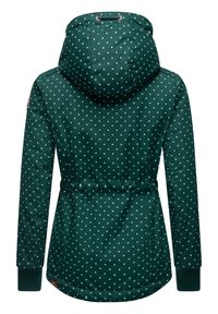 Chaqueta verde con capucha, con un patrón de lunares y cinturilla elástica. Fabricada con una tela suave y texturizada con puños de canalé.