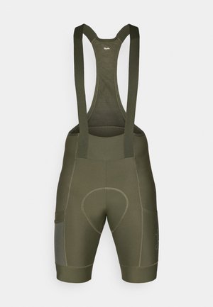 Salopette da ciclismo verde oliva con bretelle regolabili, fondello imbottito, tasche laterali e dettagli di cucitura a contrasto. Tessuto morbido ed elastico.