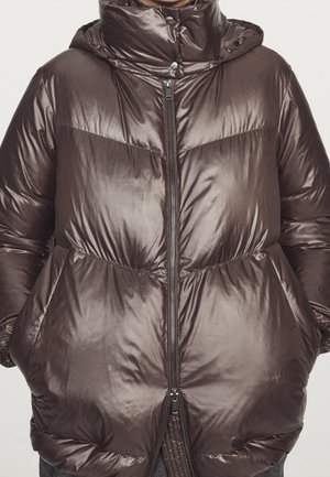 Shiny dark brown puffer jacket with high collar, front zipper, snap buttons, side pockets, and elastic cuffs worn by a person.