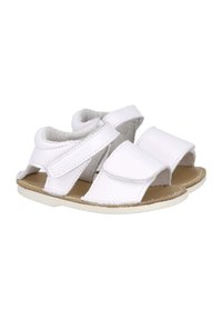 Sandalias para toddlers blancas, hechas de cuero suave, con correas de Velcro ajustables, lados abiertos y una suela de goma marrón.