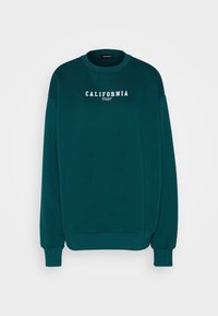 Sininen collegepaita pyöreällä kaula-aukkolla ja pitkillä hihoilla. Edessä valkoinen "CALIFORNIA"-teksti. Valmistettu pehmeästä ja kestävästä kankaasta.