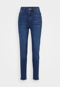 Høyt liv, slim-fit jeans i mørkeblå denim. Har fem lommer, belteseler og knappelukking med subtil falming langs bena.
