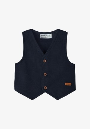 Granatowy sweter bez rękawów z dekoltem w serek, pięcioma brązowymi guzikami oraz beżową skórzaną metką. Projekt ma teksturowane wykończenie i dopasowany krój.