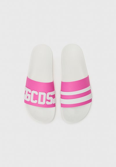 Pink slide sandals featuring a wide strap with white text and three horizontal white stripes on the upper. Soft, smooth material with a flat sole.