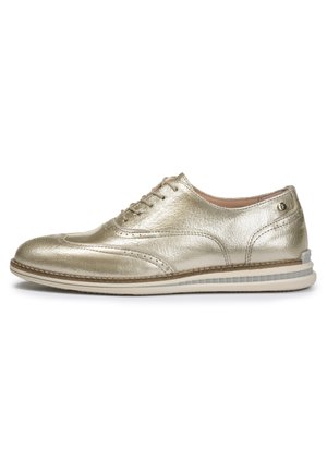 Metallic gold leather lace-up shoe with a smooth texture, perforated detailing on the toe, and a white rubber sole with gray accents.