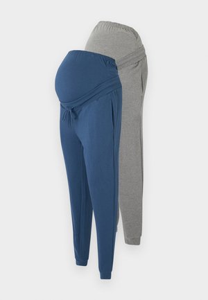 Maternitātes bikses tumši zilā un gaiši pelēkā krāsā. Izgatavotas no mīkstas auduma, ar elastīgu jostasvietu, piedurknēm pie potītēm un regulējamu auklu.