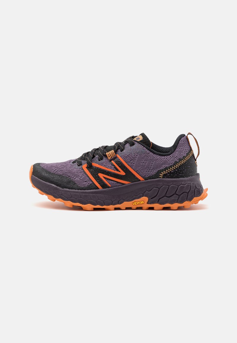 Purple and black athletic shoe with orange accents, featuring a textured mesh upper and a Vibram sole for traction.
