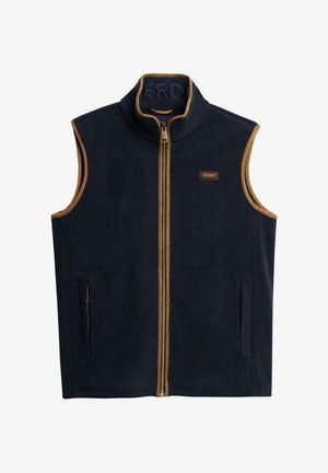Gilet in pile blu navy con colletto alto, zip dorata e dettagli marroni. Presenta due tasche laterali e un'etichetta del marchio vicino alla zip.