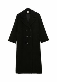 Manteau long en mélange de laine noire avec un devant croisé, de larges revers, des poches latérales et une silhouette surdimensionnée. Texture douce, design minimaliste.