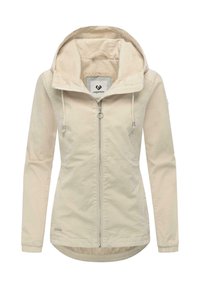 Beige zip-up-jacka med huva, dragband, slät yta och längre bakre fåll. Inkluderar en märkt inneretikett.