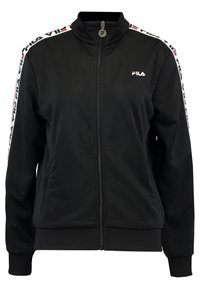 Veste zippée noire en tissu doux, avec un col montant, des poignets côtelés, des poches latérales, et une bande logo blanche et rouge le long des manches.