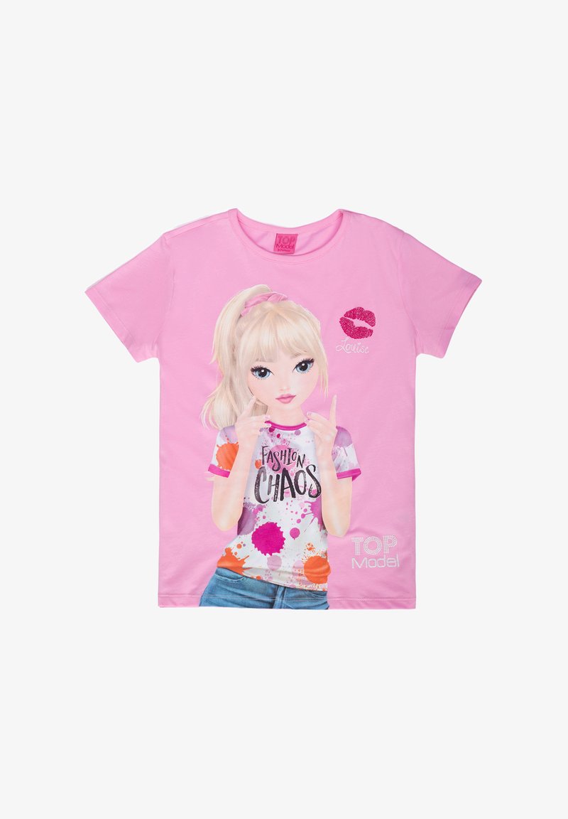 T-shirt di cotone rosa con una grafica di una ragazza con i capelli biondi. Testo "FASHION CHAOS" in nero, schizzi di vernice colorata e un segno di bacio.