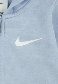 Nike Sportswear ESSENTIALS HOODED COVERALL UNISEX - Pajac - blue