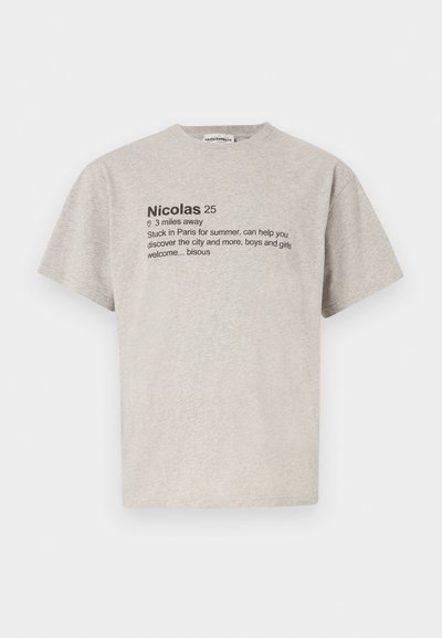 Gray cotton T-shirt with short sleeves featuring bold black text. Text includes a name, distance, and message about Paris. Simple, casual design.