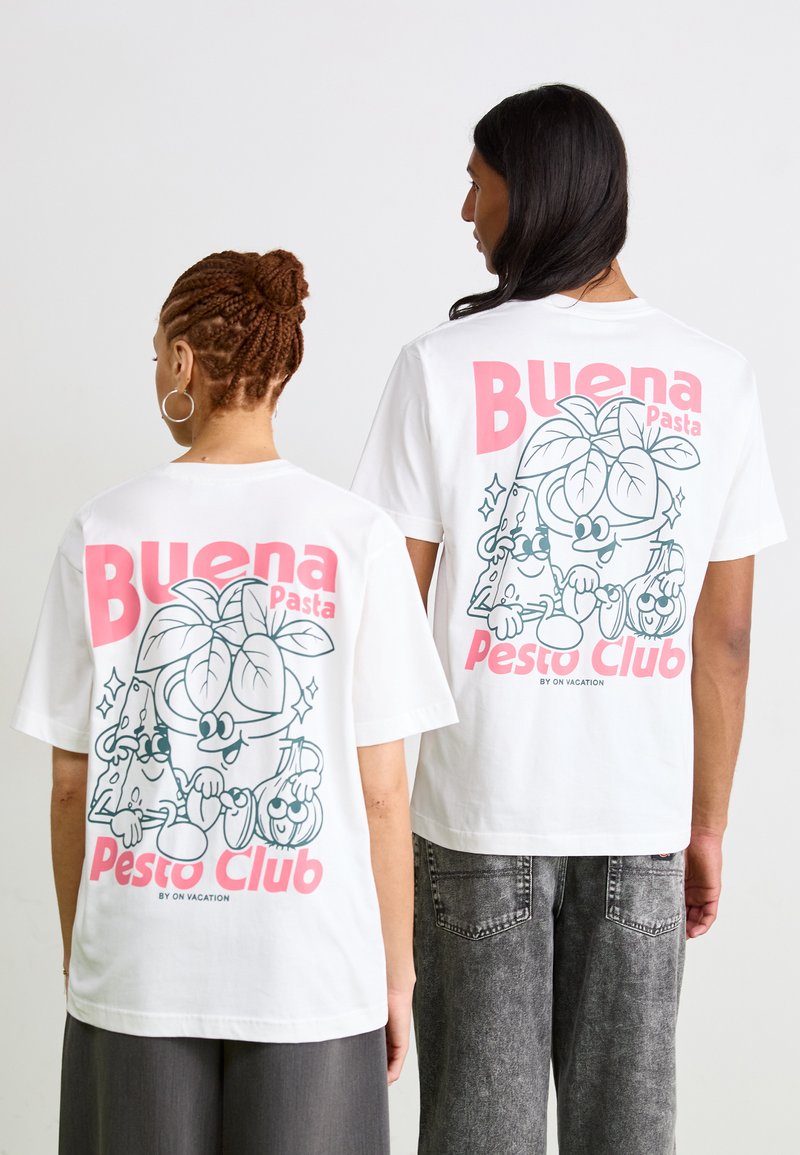 White cotton t-shirts featuring colorful cartoon graphics on the back, with the text “Buena Pasta Pesto Club” in pink and green.