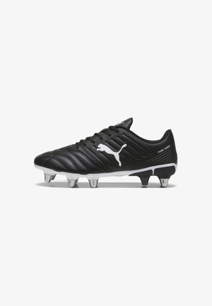 Juodas futbolo batelis su sintetine viršutine dalimi, su tekstūruotomis horizontaliosiomis linijomis ir baltu Puma logotipu. Apima šešis metalinius kulnus ant balto pado.