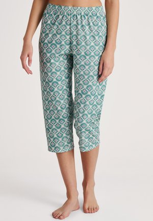 Pantaloni capri leggeri di colore verde acqua con un motivo floreale in rosa e verde. Vita elastica e design cropped. Texture morbida.