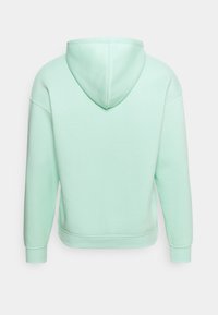 Miętowa zielona bluza z kapturem, bawełniany materiał, luźny krój, kieszeń kangurka, kaptur z regulowanym sznurkiem, ściągacze na mankietach i dole, jednolity kolor bez wzorów.