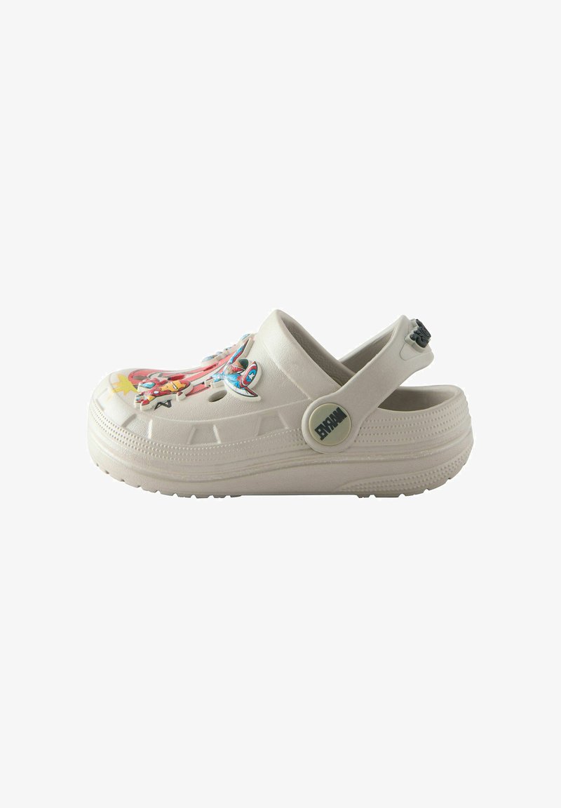 White slip-on clog with adjustable heel strap featuring superhero-themed decorative charms on the upper surface.