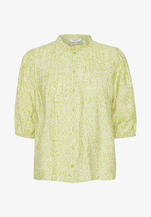 Grön och vit blus med mandarinkrage, korta puffärmar och ett abstrakt mönster; har en framknäppning med knappar.