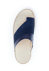 Navy blue slide sandal made of smooth leather and soft material, featuring a textured footbed and cork sole. Two overlapping straps cross the foot.