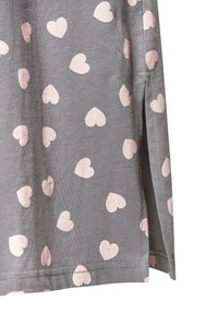 Gray fabric featuring a repeated pattern of small pink hearts, with side slits and a smooth texture.