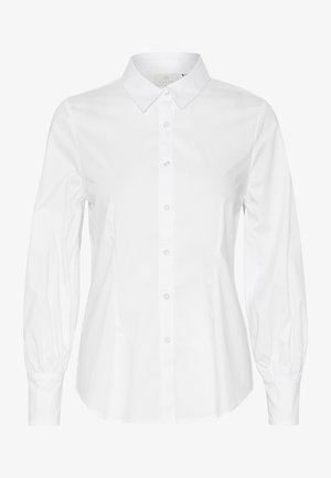 Valge pikkade varrukatega pluus, millel on klassikaline krae, nupulukk ja kogutud varrukad elastsete mansettidega. Sile ja krõbe kangastekstuuri.