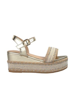 Platform sandals with a metallic gold upper, wide beaded strap, and woven jute sole. Features an ankle strap with a buckle closure.