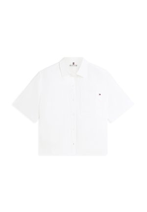 Valge lühikeste varrukatega nööpidega särk krae ja rinnataskuga, millel on väike Tommy Hilfigeri logo.