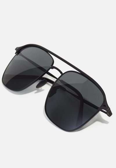 Black aviator sunglasses with dark lenses, metal frame, dual bridge design, and angled tips for a secure fit.