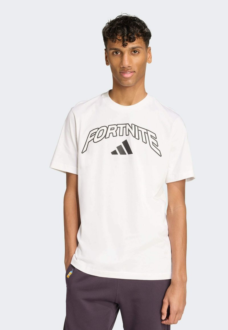 White cotton t-shirt featuring a bold black "FORTNITE" graphic and an Adidas logo. Short sleeves and a crew neck design.