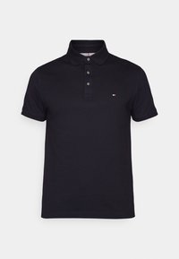 Námornícke polo tričko z bavlny, s trojitou gombíkovou légou a malým vyšívaným logom na hrudi. Krátke rukávy, hladká textúra.