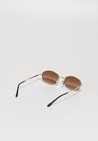 VOGUE Eyewear Aurinkolasit - pale gold-coloured
