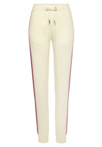Cremefarbene Jogginghosen mit rosa Seitenstreifen, aus weichem Stoff. Mit einem elastischen Bund und zwei Seitentaschen.