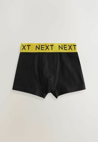Čierne boxerky s žltým elastickým pásom. Pás obsahuje opakovaný text "NEXT". Vyrobené z hladkej látky s minimálnym šitím.