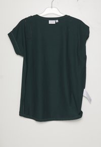 Green short-sleeve t-shirt with a rounded neckline, side slits at the hem, and a tag visible at the bottom left. Smooth texture.