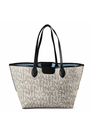 Sac cabas beige à motif répétitif "VALENTINO", poignées et bordures en cuir noir, ouverture supérieure dévoilant une doublure intérieure bleue.