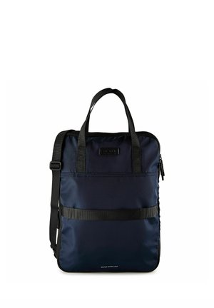 Navy blue rectangular water-repellent bag with black handles, adjustable shoulder strap, front pocket, and zip closure.