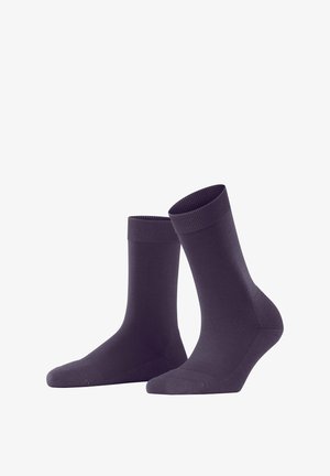Calzini viola scuro con risvolto a coste, texture liscia e design di lunghezza media. Presentano una punta senza cuciture per il massimo comfort.