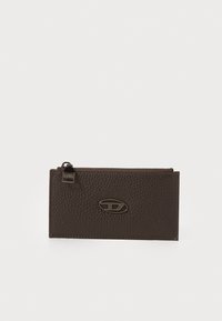 Brown leather wallet featuring a pebbled texture, a zip closure, and an oval logo accent in metallic finish.