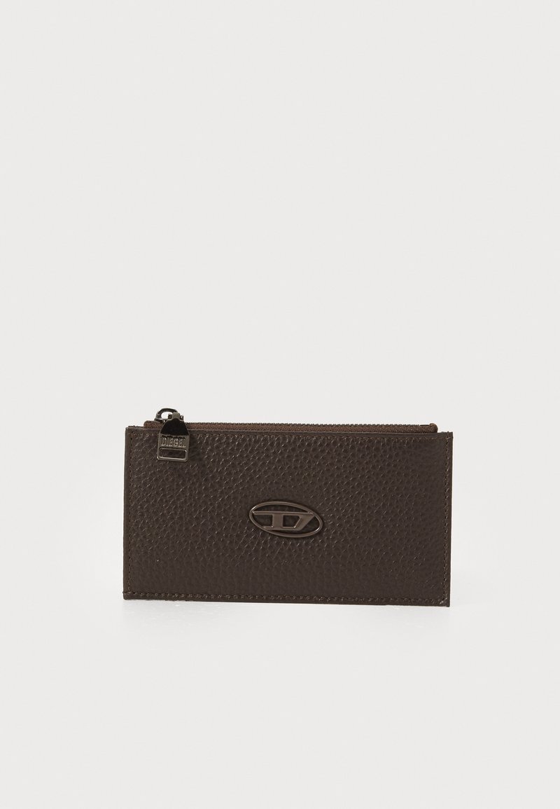 Brown leather wallet featuring a pebbled texture, a zip closure, and an oval logo accent in metallic finish.