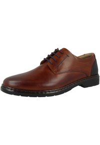Braune Lederschuhe mit runder Zehe, blauen Schnürsenkeln und einer genähten Oberseite. Mit einem schwarzen Absatz und einer strukturierten Gummisohle.