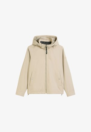 Beige capuchonjack met ritssluiting aan de voorkant, twee zijzakken en een verstelkoord bij de capuchon. Glad materiaal en een ontspannen pasvorm.